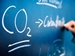 Climate Change Initiatives - CO2 (carbon dioxide) chemical symbol written on blackboard