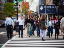 Pedestrians walking on crowded street in washington DC