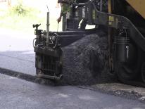 Close up of road paving machine