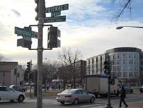 Pennsylvania Avenue SE Transportation Study - intersection scene with buildings, cars, and a traffic light pole