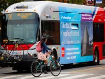 Metrobus with cyclist crossing