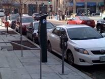 Performance-based Parking Pilots - cars parked at curb during peak hourly rates